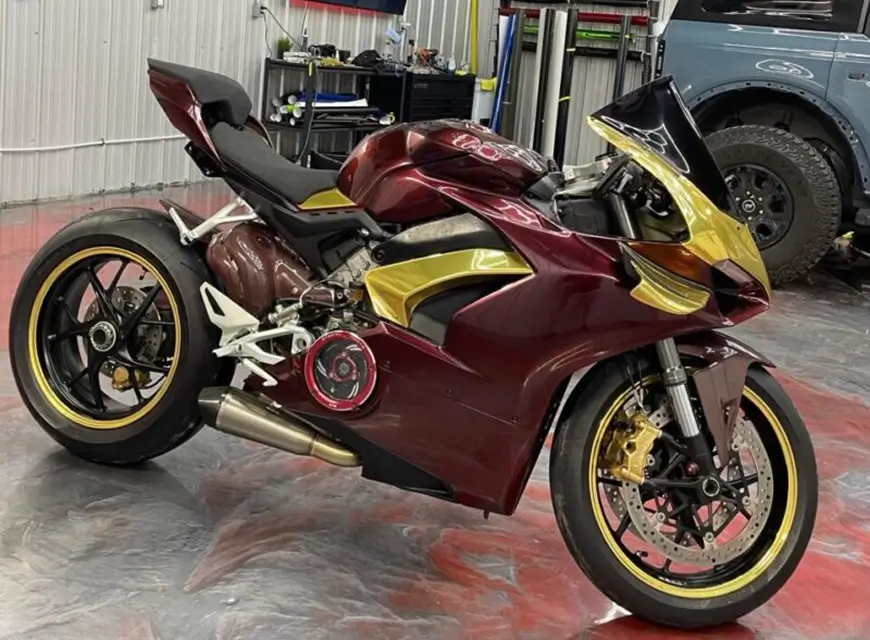 Ducati Panigale V4 wrapped in black rose with gold accents